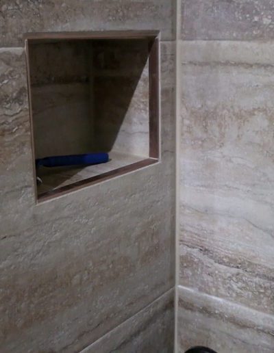 Lower shower shelf