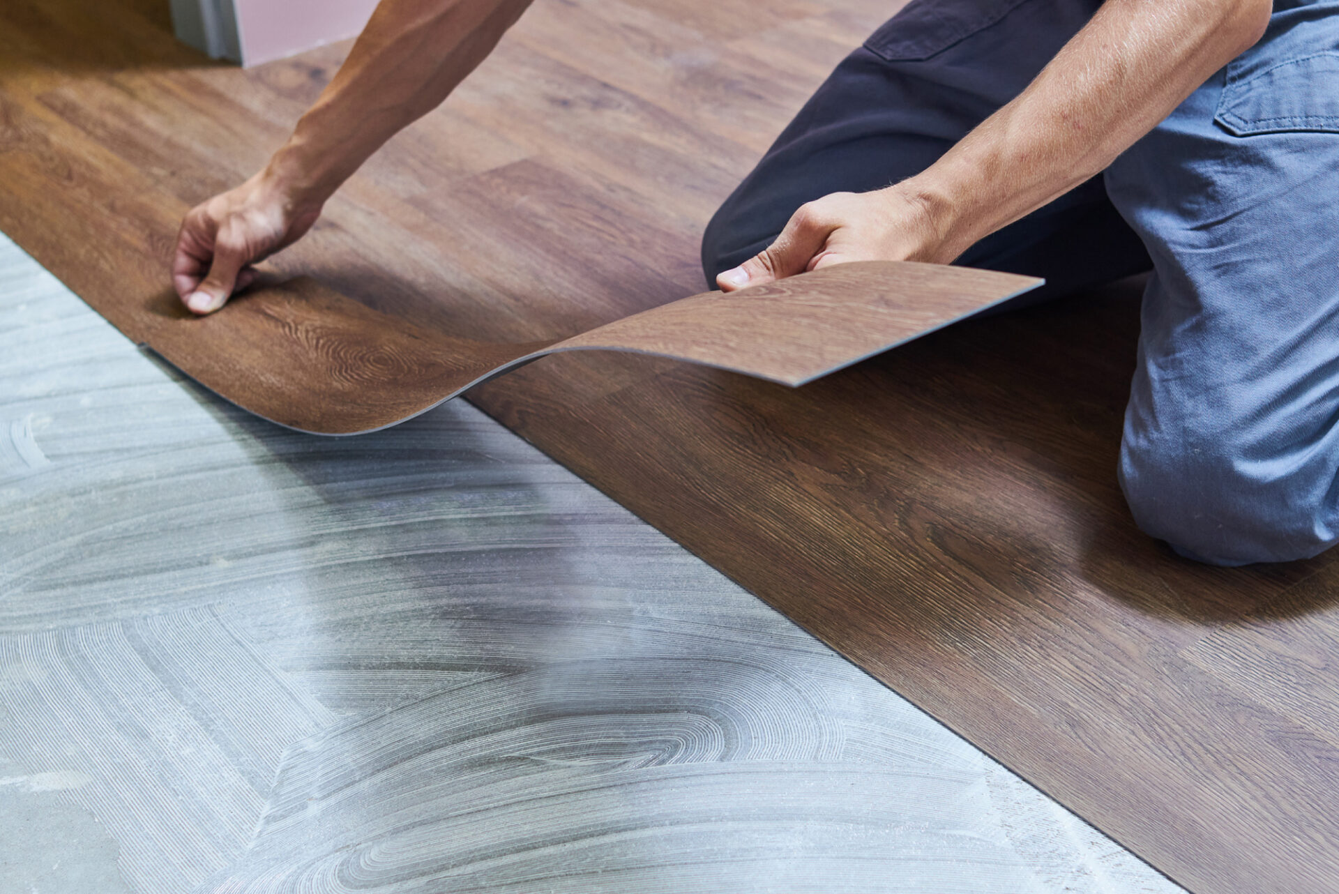 Vinyl wood flooring being installed